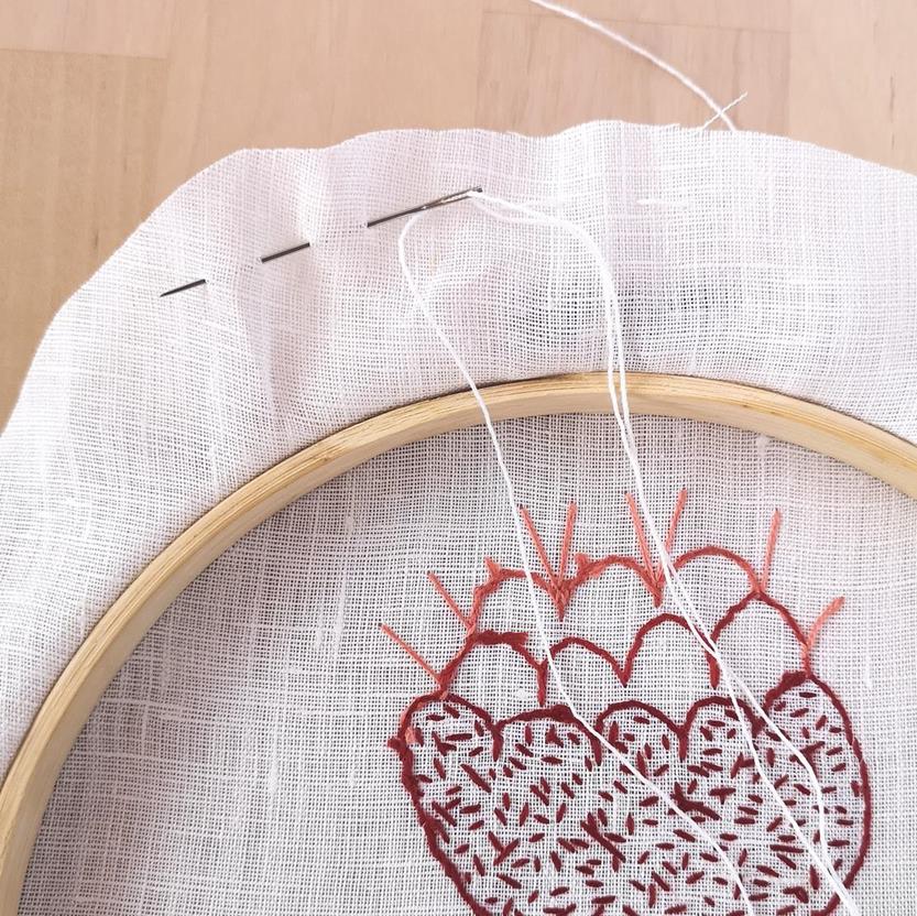 Framing the embroidery in a hoop, running stitch